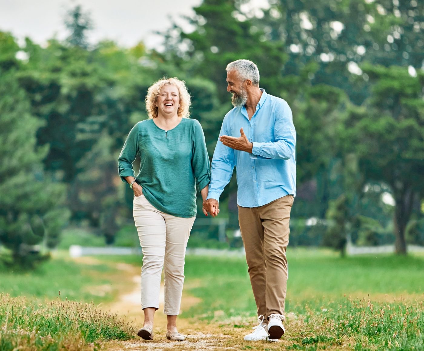 Couple walking together on a park path